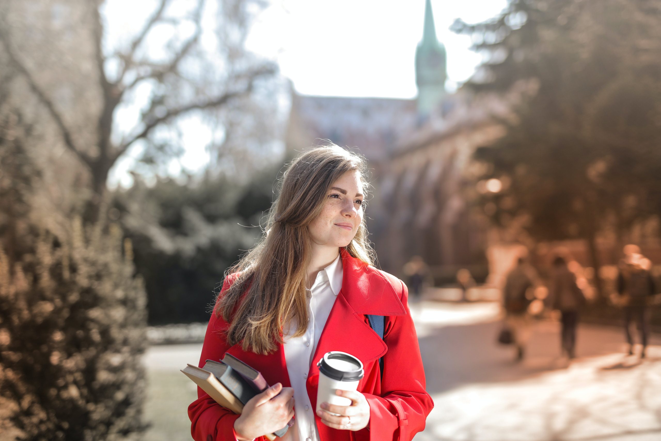 girl with coffee and books